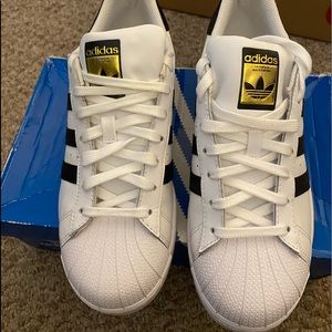 Adidas Superstars men’s 7 1/2 or women’s 9.